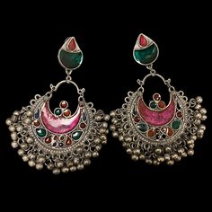 The Pink Gul Chandbali Earrings features intricate flower and peacock design on Oxidized Silver with multicolor crystals. The addition of ghungroos completes the look of this chandbali. Specifications Materials used: Oxidized Silver, Meenakari, Ghungroos At Romikas, we pride ourselves on the craftsmanship and high quality of our jewelry, designed to enhance your natural beauty. Please contact us with any questions. Multicolor Chandbali Jhumkas With Intricate Design, Festive Multicolor Chandbalis With Intricate Design, Bollywood Style Multicolor Chandbalis With Intricate Design, Bollywood Style Multicolor Peacock Jhumkas, Traditional Silver Jeweled Jhumkas, Festive Multicolor Chandbalis In Fusion Style, Traditional Peacock Chandbalis For Festivals, Festive Multicolor Fusion Chandbalis, Festive Multicolor Fusion Style Chandbalis