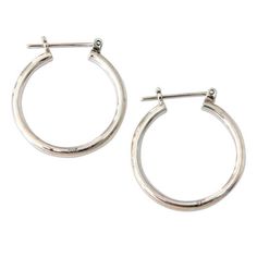 A timeless classic, hoop earrings remain everyone's favorite. Nyoman Rena crafts these fashionable earrings by hand, ensuring a high polished sterling silver finish. Said to be consecrated to the Moon Goddess, silver is believed to have a soothing and calming effect. Sterling Silver Saddleback / sea catch earrings High polish finish Handmade in Indonesia White Gold Sterling Silver Hoop Earrings For Pierced Ears, Nickel Free Hoop Earrings For Everyday, Nickel-free Hoop Earrings For Everyday, Hypoallergenic Open Circle Hoop Earrings For Gift, Modern Nickel-free Small Hoop Jewelry, Nickel-free Elegant Huggie Earrings, Elegant Rounded Sterling Silver Earrings, Silver Huggie Earrings With Sterling Silver Clasp, Elegant Sterling Silver Rounded Earrings