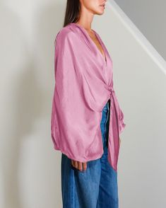 The Culhane Top is a v-neck top featuring statement sleeves with elastic cuffs and a tie detail at the front. Please kindly note that mark down items are final sale. Pink Long Sleeve Viscose Top, Pink V-neck Top With Vibrant Print, Pink Silk Button-up Top, Pink Silk Button-up Blouse, Pink Long Sleeve Top With Soft-washed Detail, Midi Gowns, 7 Jeans, Statement Sleeves, Final Sale