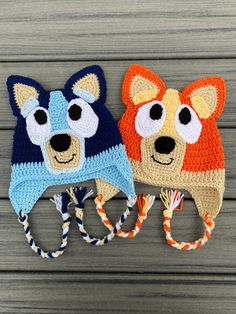 two crocheted hats with dogs on them