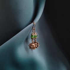 Elevate any look with these gorgeous handmade whimsical earrings. Especially great for Dark Academia, Cottagecore and Whimsygoth aesthetic. Handmade in the Netherlands 🧡 Length from ear piercing: 6 cm/2.4 inch, Width: 1.5 cm/0.6 inch If you have any questions feel free to message me :) Pierced Green Copper Earrings, Green Copper Pierced Earrings, Gothic Brass Dangle Earrings, Handmade Gothic Plug Earrings As Gift, Vintage Metal Beaded Earrings For Gift, Metal Dangle Earrings For Crafting, Handmade Bronze Beaded Earrings For Gift, Gothic Handmade Drop Earrings, Gothic Brass Earrings Nickel Free