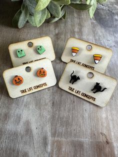 Charming halloween earring stud set!  Candy corn, ghosts, spooky black cats, pumpkins. Earrings are wood and sealed with a glossy resin finish for durability.  These are a perfect gift for someone special! Girls, busy moms, teachers!  Nickel free hardware is used, with a metal and rubber backer to keep earrings in place! The earrings are lightweight and eco friendly! 1/2 inch.  Follow us on Social Media!   IG: www.instagram.com/truelifeconcepts FB: facebook.com/truelifeconcepts.etsy/ Back to the Playful Halloween Earrings For Gifts, Playful Halloween Earrings As A Gift, Playful Halloween Earrings For Gift, Cute Orange Halloween Earrings, Cute Orange Earrings For Halloween, Cute Halloween Earrings For Pierced Ears, Earring Stud Set, Lantern Earrings, Spooky Black