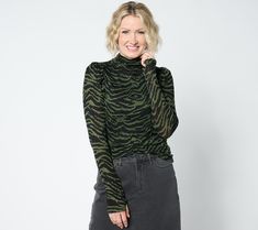 Just what your wardrobe needs -- a versatile long-sleeve top you can wear solo or layered under a jacked or blazer. The cozy funnel neckline keeps you warm, while thumbholes at the cuffs are an edgy detail that brings a touch of fashionable functionality to this chic everyday style. From Studio ParkTM x Shawn Killinger. Winter Stretch Long Sleeve Top With Thumbholes, Trendy Mock Neck Top For Winter, Winter Long Sleeve Top With Thumbholes, Winter Funnel Neck Turtleneck With Thumbholes, Winter Turtleneck With Thumbholes And Funnel Neck, Spring Workwear Long Sleeve Turtleneck, Long Sleeve Turtleneck For Spring Workwear, Long Sleeve Turtleneck For Work In Spring, Spring Long Sleeve Turtleneck For Work