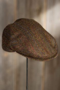 From its humble beginnings in the early 1900s, the low profile flatcap has grown into high profile everyday fashion. The proud Benson Ivy is crafted from hand woven Harris Tweed in a subtle plaid herringbone for a refined hat that's full of character and irresistible for everyday wear. The Benson features a 2½” brim with contrast plaid beneath and a leather strap in back that adjusts to the perfect fit. It's finished with soft satin lining and comfy leather sweatband for a favorite 3-season hat. Fall Outdoor Flat Cap, Classic Tweed Hat With Short Brim, Vintage Flat Bill Hat For Fall, Adjustable Brimmed Hat With Herringbone Pattern, Classic Adjustable Tweed Hat, Classic Tweed Hat With Curved Brim, Classic Hat With Herringbone Pattern And Curved Brim, Classic Hat With Curved Brim And Herringbone Pattern, Classic Brimmed Tweed Hat