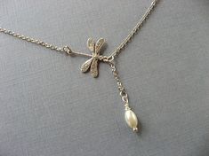 This pretty necklace features a tiny 17mm dragonfly suspended from an 17” silver plated chain. This can be worm casually with a tee or as a sophisticated necklace for more formal occasions. If you prefer a different length, just let me know in the note to seller during checkout. All Pearl Lariat Necklace, Pearl Lariat, Pretty Necklace, Dragonfly Necklace, Handmade Jewelry Necklace, Crescent Moon Necklace, Infinity Necklace, Pretty Necklaces, Girls Necklaces