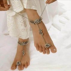 Do you like ghungroos in your anklets or payal? Then, it is the right time to buy these silver payal anklets with beads and dainty chains. This Indian jewelry is very skin-friendly and perfect for festivals, weddings, parties, and traditional occasions. You can gracefully pair a kurti, saree, or any Indo-western outfit to enhance your look with this silver Indian jewelry. The best part about these anklets is that they can be worn for a long period of time without any itching and swelling. Always Bohemian Metal Anklets With Adjustable Chain, Bohemian Anklets With Adjustable Chain, Bohemian Metal Anklets With Silver Beads, Festive Bohemian Silver Beads Anklets, Bohemian Festive Anklets With Silver Beads, Bohemian Metal Toe Ring Anklets, Bohemian Wedding Anklets With Latkans, Metal Anklets For Festivals Gift, Adjustable Metal Anklet For Festive Occasion