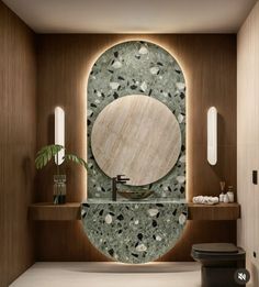 a bathroom with a circular mirror above the sink