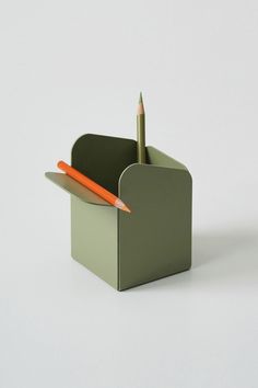 a pencil and pen holder on a white background