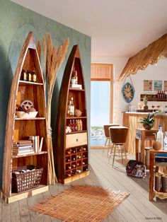 two canoe shaped shelves in a living room next to a dining room table and chairs