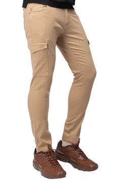 Solid chino pants constructed from comfortable stretch twill feature roomy cargo pockets for contemporary style. 13" leg opening; 9 3/4" front rise (size 32x32) Zip fly with button closure Five-pocket style Leg cargo pockets Skinny leg Stretch twill construction 64% cotton, 33% polyester, 3% spandex Machine wash, tumble dry Imported Model stats: 6'1" height, 32" waist. Model is wearing size 32x32. Relaxed Fit Chino Cotton Twill Pants With Cargo Pockets, Utility Chino Cotton Twill Pants With Pockets, Utility Pants In Chino Cotton Twill With Pockets, Chino Cotton Twill Cargo Pants With Tapered Leg, Stretch Full-length Chinos With Pockets, Stretch Full Length Chinos, Utility Chino Cotton Twill Cargo Pants Straight Leg, Straight Leg Chino Cotton Twill Cargo Pants, Chino Cotton Twill Cargo Pants With Pockets