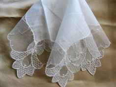 Gorgeous vintage fancy hanky bridal hanky for a modern bride wedding handkerchief. This fine hankie has exquisite, intricate and beautiful lace. It measures 11 inches by 11 inches, fine linen center, in wonderful condition, looks never used. Would be very pretty to frame or make wonderful heirloom quality gifts for the bride or bridal party or any other special occasion. Small enough to be slipped into a greeting card for a lovely gift. Please do view our other beautiful vintage and antique hank Elegant Lace Work Handkerchief For Wedding, Elegant Lace Work Wedding Handkerchief, Elegant Lace Work Handkerchiefs Gift, Elegant Lace Wedding Handkerchief, Elegant Wedding Handkerchief With Lace Work, Elegant White Lace Handkerchiefs, Elegant White Handkerchiefs With Lace Work, Lace Handkerchiefs With Lace Trim For Wedding, Elegant White Handkerchiefs For Wedding Gift