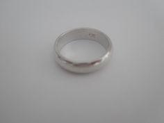 Sterling Silver solid band. Signed 925. Ring is in good used condition, it does have some scratches that can be buffet out by a jeweler. Size 7 Thank you and be sure to check out my other fine listings. https://www.etsy.com/shop/TraderTrudys Have a blessed day. Classic Sterling Silver Wide Band, Sterling Silver Thick Band For Formal Occasions, Formal Sterling Silver Thick Band, Classic Silver Band Ring, Classic Silver Band Jewelry, Hallmarked Sterling Silver Band For Formal Occasions, Formal Sterling Silver Round Bands, Silver Wedding Band, Chic Sunglasses