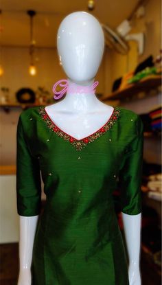 Bottle green color cotton silk kurta with cotton lining . Beautiful thread and beaded work on the neck. sleeve length:3/4th kurti length:46 Thread Work Neck Designs For Kurtis, Festive Kurta With Embroidered Neckline In Cotton Silk, Festive Cotton Silk Kurta With Embroidered Neckline, Elegant Green Chanderi Blouse, Festive Straight Kurta With Embroidered Neckline, Green Blouse With Resham Embroidery For Eid, Green Zari Work Blouse For Eid, Green Blouse With Zari Work For Eid, Green Chanderi Blouse For Party