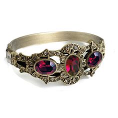 "This rich, unusually impressive bracelet is created from 90 year old stones set into our studio's original sculpture. The bracket is finely detailed and set with premium Swarovski smoke crystal. Three oval stones are vintage beauties from the 1930s which I acquired from a former exporter in Czechoslovakia. The bracket is mounted on a split shank cuff and will comfortably fit 7 to 8\" wrists. Hand burnished warm bronze finish. Entirely made in our Los Angeles studio. Choices: AMETHYST EMERALD RU Victorian Jeweled Wedding Bracelets, Victorian Jewelry Bracelet With Jewels, Victorian Jeweled Bracelets For Formal Occasions, Heirloom Gemstone Bracelet, Heirloom Gemstone Bracelet Jewelry, Collectible Gemstone Bangle Bracelets, Elegant Oval Jeweled Bracelet, Elegant Oval Jeweled Bracelets, Unique Jeweled Bangle Jewelry