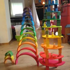 there are many different colored toys on the floor in this room, and one is made out of blocks