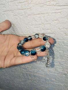 🌌✨ Discover the beauty of our Handmade Galaxy Bead Bracelet! 🌟  This elegant piece features stunning blue galaxy beads that create a mesmerizing space-themed look. 🌠 Handcrafted with care, this cosmic charm bracelet is designed to dazzle with its shimmering celestial stones.  🌟 Whether you're looking for a unique accessory or a fashionable cosmic bracelet, this eye-catching piece is perfect. 💫 Embrace the luxury of space jewelry and make a statement with our stylish celestial bracelet.  🌌💙 Elevate your style with this beautiful gemstone bracelet, featuring radiant blue charms and a starry design that's sure to turn heads. 🌠🔮 Don't miss out on this gorgeous, handmade galaxy bracelet that blends cosmic allure with chic elegance! 🌟🌌 Blue Crystal Bracelet With Colorful Beads, Blue Crystal Bracelet With Faceted Beads, Blue Faceted Beads Bangle Jewelry, Blue Round Spiritual Charm Bracelet, Handmade Blue Round Crystal Bracelet, Handmade Blue Crystal Beaded Bracelets, Blue Spacer Beads Bangle Jewelry, Blue Faceted Bead Bangle, Blue Bangle With Faceted Beads