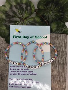 two bracelets that say first day of school