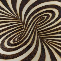 an image of a wood carving with swirls in it's center and sides