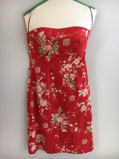 "Fabulousness in a spring/summer semiformal dress! I loved wearing this to both my high school + college graduations. I felt feminine, bold, and ready to take on the world! A simple sheath dress, yet soft floral print layered over bold red backdrop, paired w/ scalloped red stitching along upper bodice + hem...gives it more of a unique + refreshing feel. AND it was Y2K, so you HAD to add in Chinese characters for good measure! Actually, apparently this designer enjoyed incorporating her Chinese heritage in her work, so I'm sure that was the REAL reason. Fair Vintage Condition No tears, all seams sturdily still intact, and little wear to fabric. A well constructed, fully lined dress. It does have several stains on front of skirt (see photos). While stains blend relatively well amidst the bol Red Mini Dress With Fitted Bodice For Spring, Floral Print Mini Dress For Summer Homecoming, Summer Homecoming Mini Dress With Floral Print, Red Summer Mini Dress For Prom, Red Mini Dress For Summer Prom, Red Summer Dress For Homecoming, Red Dress For Summer Homecoming, Red Dresses For Summer Homecoming, Red Homecoming Summer Dress