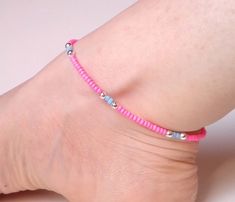 "Bright, bold and beautiful! This neon pink and blue beaded anklet is crying out to be worn for care free days in the sun. To create this summery anklet I've combined neon pink seed beads with shiny silver plated and matte blue beads.  With a hint of an Aztec feel to it, this ankle bracelet is bound to make you smile! This beaded anklet measures approximately 9.75\" long and fastens with a silver plated bolt clasp.  I am more than happy to provide custom-length anklets but please do get in touch Pink Anklet, Seed Bead Anklet, Starfish Anklets, Leather Anklets, Ankle Bracelets Diy, Bead Anklet, Beaded Ankle Bracelets, Beaded Ankle, Beaded Anklet