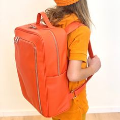 The orange backpack, my friends. It's here and it allows you to own that true orange backpack that you've been hunting! You found it! Monochrome backpacks are here to enhance your coolness (not ours!). They're for you. We're working on our own coolness...you work on yours by enjoying the vegan leather love of our orange backpack. Orange you glad? Vegan Leather. 14 x 17 x 7 Functional Orange Backpack For School, Orange Travel Bag For Back To School, Orange Rectangular Backpack For Everyday, Rectangular Orange Backpack For Everyday Use, Orange Backpack For Everyday Use And Back To School, Orange Travel Backpack With Zipper Closure, Functional Orange Backpack For Travel, Functional Orange Travel Backpack, Orange Standard Backpack For School