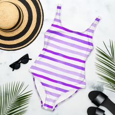 Embrace Summer Vibrancy with the Berry Breeze One-Piece Swimsuit! Elevate your poolside style with the Berry Breeze One-Piece Swimsuit. Inspired by the vibrant colors of summer berries, this suit features various shades of purple that evoke the sweet and tangy essence of fresh-picked berries. Designed for comfort and durability, it’s available in various sizes to perfectly fit every body type. 82% Polyester, 18% Spandex Fabric weight: 6.78 oz/yd² (230 g/m²), weight may vary by 5% Chlorine-resist Summer Swimwear With Uv Protection For Sunbathing, Summer Swimwear With Uv Protection For Poolside, Trendy Summer Tankini For Pool, Summer Uv Protection Swimwear For Poolside, Uv Protection Swimwear For Summer Poolside, Tropical One-piece Swimsuit For Summer, Tropical One-pieces For Summer Swimming, Summer Swimwear With Upf 50+, Trendy Bodysuit For Sunbathing In Summer