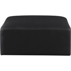 a large black ottoman sitting on top of a white floor