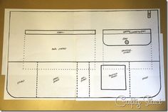 a paper cut out of a floor plan on a piece of white paper with black lines