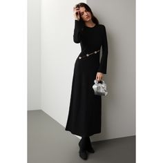 Black knit (92% Viscose, 8% Spandex). A-line. Long sleeves. Crewneck. Pull on. 46" from shoulder to hemline. Made in the USA of imported fabric. Fall A-line Maxi Dress For Night Out, Winter A-line Midi Dress For Night Out, Stretch A-line Maxi Dress For Evening, Stretch A-line Maxi Dress For Night Out, Chic Fitted A-line Sweater Dress, Black Fitted Maxi Sweater Dress, Chic Stretch A-line Sweater Dress, Fitted Black Maxi Sweater Dress, Elegant Stretch Maxi Dress For Fall