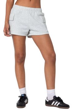 Soft cotton fleece adds cozy comfort to these relaxed shorts popped with on-trend cargo pockets for an ultracool look. Elastic waist Cargo flap-patch pockets 100% cotton Machine wash, dry flat Imported Leisure Shorts With Pockets, Sporty Cotton Cargo Shorts With Elastic Waistband, Sporty Cotton Bottoms With Multiple Pockets, Athleisure Bottoms With Pockets And Short Length, Sporty Cotton Cargo Shorts, Sporty Short Bottoms With Cargo Pockets, Comfortable Cotton Shorts With Pockets, Sporty Short Length Bottoms With Cargo Pockets, Sporty Gray Cotton Shorts