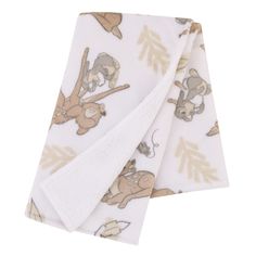 two towels with animals on them and one has a white towel hanging from it's side