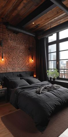 a bedroom with brick walls and flooring has a large bed in front of the window