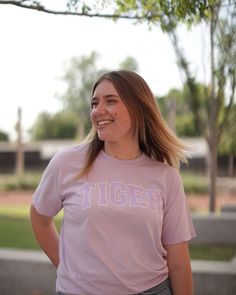 Don't be fooled by the claws that we got, still the nicest Tigers on the Block! Represent the best college mascot wherever you geaux with our Comfort Colors Tiger Block t-shirt available in three colors: Orchid, Butter, & Heather Grey. 100% Pre-Shrunk CottonUnisexOrchid Sizing: S M L XL 2X 2/4 6/8 10/12 14/16 16/18 Collegiate Pre-shrunk T-shirt For Campus, Purple T-shirt With Team Name For Campus Wear, Collegiate Style Screen Printed Tops, Collegiate Screen Print Top For Campus, Collegiate Style Screen Print Tops For Campus, Campus Fan Apparel T-shirt With Letter Print, Cotton College Mascot Tops, Sporty College Mascot T-shirt, Casual Purple Game Day Top