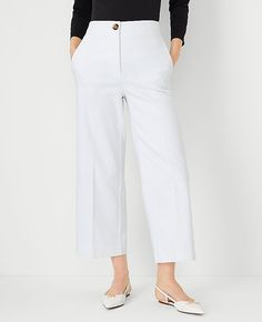 Elevate your wardrobe with the chic sophistication of Ann Taylor's The Kate Wide Leg Crop Pant. Perfectly tailored to flatter your figure, these pants boast a high-rise fit that sits just below the natural waist and a wide leg silhouette that adds a modern twist to your ensemble. The crisp white color enhances its versatility, making it a must-have for any fashion-forward wardrobe.

- Size: 4
- Color: White
- Gender: Female
- Material: 52% Cotton, 45% Polyester, 3% Elastane
- Fit: Tailored and f Cropped Leg Workwear Bottoms, Spring Business Casual Wide Leg Pants With Welt Pockets, Cropped Wide Leg Pants With Welt Pockets For Work, Spring Wide Leg Ankle-length Pants With Welt Pockets, Spring Ankle-length Wide Leg Pants With Welt Pockets, Elegant Cropped Leg Bottoms With Welt Pockets, Classic Wide Leg Culottes For Spring, Wide Leg Pants With Pockets And Straight Hem, Classic Spring Workwear Culottes