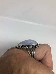 great color blue Lace agate stone The setting is handcrafted in low content silver About an inch long Size 7.5 Can be sized. My jeweler charges between $10-$15. All rings are shipped in a nice gift box. Check out our over a THOUSAND great reviews Engraving is $4 per letter and is not always perfect depending on the piece. It can take a few days if the jeweler is busy. This is payable to Paypal Judithsltd@gmail.com Adjustable Chalcedony Jewelry For Anniversary, Blue Oval Agate Jewelry, Oval Blue Agate Jewelry, Blue Amethyst Gemstone Ring Gift, Blue Moonstone Healing Ring, Spiritual Blue Moonstone Ring, Blue Cabochon Gemstones For Rings, Blue Natural Stone Crystal Ring In Sterling Silver, Adjustable Blue Opal Gemstone Ring