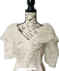 Embroidered Organza Blouse For Wedding, Fitted Organza Blouse With Embroidery, Fitted Embroidered Organza Blouse, White Organza Top For Wedding, Short Sleeve Tops With Intricate Embroidery For Wedding, Short Sleeve Wedding Blouse With Intricate Embroidery, Wedding Blouse With Intricate Embroidery And Short Sleeves, Fitted Short Sleeve Blouse For Wedding, Elegant Embroidered Tops For Wedding