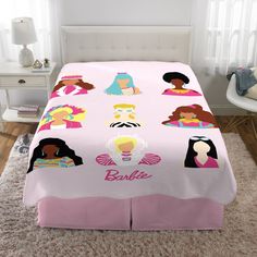 a bed covered in pink sheets with princesses on it