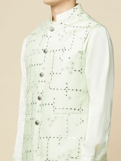 This Mint Green Kurta Bundi Jacket Set will instantly give an elegant look. This 3 piece kurta bundi set features a mint green mirror embroidered bundi jacket with a mint green kurta, front button placket, and a mandarin collar. It is paired with white churidar pants. An ideal outfit for traditional occasions, and special events.

Size Chart For Men





	
	
					Men's Size Chart
		

		
		
						
				Size Chart For Men
				Custom Size Measurement Guide
			
			
				
				
				Custom Size Measureme Spring Pista Green Kurta With Mirror Work, Spring Wedding Nehru Jacket With Gota Work, Spring Wedding Sherwani With Gota Work, Spring Sherwani With Gota Work, Green Bandhgala With Zari Work For Spring, Spring Green Bandhgala With Resham Embroidery, Spring Festive Sherwani With Gota Work, Spring Festive Bandhgala With Gota Work, Fitted Green Sherwani For Spring