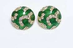 Oscar de la Renta green enamel and crystal earrings in excellent condition. Approximate Measurements: Diameter 0.9” Made in USA. Green Enamel Clip-on Jewelry, Formal Green Enamel Jewelry, Green Metal Earrings For Formal Occasions, Green Metal Clip-on Earrings, Green Enamel Clip-on Earrings, Jeweled Enamel Earrings For Gift, Green Jeweled Earrings For Formal Occasions, Green Metal Clip-on Earrings For Gift, Enamel Jeweled Earrings For Gift