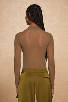 Elegant yet bold, the Giselle Bodysuit is your new go-to for a statement look. Crafted from soft olive mesh, this high-neck design offers a sleek silhouette that perfectly balances allure with sophistication. Model is 5'9 and wearing size Small High Neck Designs, Sports Accessories, Neck Designs, Jumpsuit Dress, Best Sellers, High Neck, Jumpsuit, Sleek, Mesh