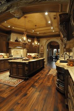 a large kitchen with wooden floors and chandeliers