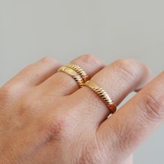 A great simple textured band ring to add to your daily stack! Fabulous alone or stacked, this baby is made in 14K Gold Filled and meant to last so no need to take it off. It is made to order to fit any size, top knuckle or base of your finger. Each ring will have it's own unique pattern like the ones shown, and will not be exactly the same in pattern. Ring is 3.8mm wide AVAILABLE IN ANY SIZE, please specify your size or sizes when ordering! +Ring holder by the amazing Lenny Mud : https://www.ets Ring Simple Gold, Ring Engraving, Gold Stacking Ring, Simple Texture, Ringe Gold, Pattern Ring, Gold Ring Stack, Gold Band Ring, Rings Simple