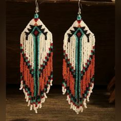 Approx 5" Handcrafted Beaded Dangle Earrings Southwestern Boho Style Golden Orange , Teal , Black , And Natural White Beads Most Of My Other Earrings Are Dangle Types (Like These) That Can Be Upgraded To Solid Sterling Silver Or 14k Gold Filled Wires. I Also Have Some Extra Stainless Steel Wires And Gold Tone Wires So I Can Customize These For You At No Cost If You Prefer One Of Those. I Have A Background In Jewelry Design In Nyc And I Buy My Ear Wires From A Legitimate Metal Source Jewelry Supp Southwestern Dangle Beaded Earrings For Festivals, Southwestern Style Dangle Beaded Earrings For Festivals, Southwestern Style Beaded Dangle Earrings For Festival, Southwestern Beaded Earrings With Tassels For Festival, Southwestern Fringe Earrings For Festivals, Traditional Beaded Earrings With Fringe For Festivals, Traditional Beaded Fringe Earrings For Festival, Southwestern Adjustable Beaded Fringe Earrings, Southwestern Tassel Earrings For Festivals