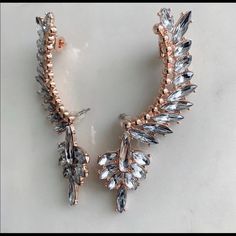 Brand New. Handmade Large Ear Cuff Earrings. Nickel Free. Hypoallergenic. 24k Rose Gold Plated. A Signature Studio Statement Piece. Absolutely Stunning Victorian Style Crystal Ear Crawler Earrings That Will Steal The Spotlight And Upgrade Any Outfit. Wear It As A Pair Or Go Asymmetrical And Wear It Only One Ear. 3" Length. Https://Www.Etsy.Com/Shop/Calisades?Ref=Seller. Platform-Mcnav Crystal Ear Cuff, Crawler Earrings, Flower Earrings Gold, Ear Cuff Earrings, Ear Crawler, Ear Crawler Earrings, Punk Earrings, Cat Earrings Studs, Ear Climber