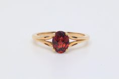 This ring features a CAD checkerboard Oval cut dark redish color Garnet accented by two small Diamonds all set into 10k solid gold. Weight: approx. 2.3 grams Size approx. 8 Markings : 10k Stone Info: Garnet: approx. 8.0x6.1mm oval As this is a pre-loved piece there are minor signs of wear that can include light marks in the metal and the surface of the stones. The ring has been polished to remove most of the surface scratches that the piece acquired over the years - there is still some remaining. Please note that colors may differ slightly depending on the settings of your device. The ring in the photos are the exact piece you will receive. We ship five days a week, Monday thru Friday. We will try to have your order shipped the next business day. Classic Garnet Solitaire Rings, Classic Solitaire Garnet Ring, Classic Yellow Gold Garnet Birthstone Ring, Classic Garnet Birthstone Ring In Yellow Gold, Classic Yellow Gold Garnet Rings, Heirloom Garnet Oval Birthstone Ring, Oval Garnet Ring In Yellow Gold, Gold Oval Garnet Birthstone Ring, Oval Garnet Ring With Center Stone