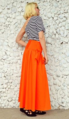 Extravagant orange skirt made of pure cotton, very light, colorful and playful. This flared long skirt is extremely comfortable and fun to wear, being a piece that will brighten up the streets and steal the spotlight! Material: 95% Cotton, 5% Elastane Care instructions: Wash at 30 degrees The model in the picture is size S. Can be made in ALL SIZES. If you have any other specific requirements, do not hesitate to contact me! I DO NOT CHARGE EXTRA MONEY for custom made items. All you need to do is High Waist Cotton Skirt For Summer, Orange Cotton Bottoms For Spring, Spring Orange Cotton Bottoms, High Waist Cotton Gathered Skirt, High Waist Gathered Cotton Skirt, High Waist Cotton Gathered Maxi Skirt, Summer Cotton Full Skirt Bottoms, Summer Full Skirt Cotton Bottoms, Summer Full Skirt Bottoms In Cotton