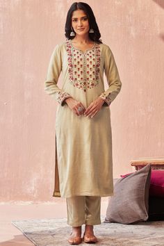 A beautiful kurta pant set perfect for the winters to brighten up any grey gloomy day☀️ Part of a limited edition faux wool collection in a beautiful beige colour , features an exclusive hand embroidered detail on neck and sleeves. Perfect for a festive occasion or a cold day out 🌸  Available in size M only!  Fabric & Lining: faux wool with modal lining Kurta : Outer: Handloom Acrylic wool, Inner: Muslin (55% Modal, 45% Viscose) Pants : handloom acrylic  Craft: Resham dori embroidery on the yok Fall Floral Embroidered Straight Kurta, Festive Fall Kurta With Chikankari Embroidery, Festive Kurta With Chikankari Embroidery For Fall, Chikankari Embroidery Kurta For Festive Occasions In Fall, Unstitched Resham Embroidery Kurta For Fall, Fall Embroidered Kurta, Winter Anarkali Kurta With Resham Embroidery, Embroidered Cotton Sets For Fall, Beige Embroidered Palazzo Set For Diwali