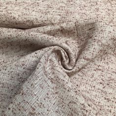 a close up view of a fabric with small squares on it, in brown and white