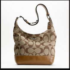 Signature Pieced Duffle Style: F17490 Signature Fabric With Brown Leather Trim Inside Zip, Cell Phone And Multifunction Pockets Zip-Top Closure, Fabric Lining Double Strap Converts To Single Long Strap For Shoulder Or Crossbody Wear 10 3/4" (L) X 10 1/2" (H) X 3 1/2" (W) In Gently Used Condition Brown Coated Canvas Hobo Bag For Travel, Travel Brown Coated Canvas Hobo Bag, Trendy Brown Bag With Leather Trim, Cognac Hobo Bag For Travel, Casual Brown Shoulder Bag With Branded Hardware, Classic Coach Beige Hobo Bag, Elegant Brown Coated Canvas Hobo Bag, Beige Leather Trim Hobo Bag, Chic Bag With Leather Trim