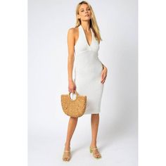 This V Neck Halter Midi Dress Is The Perfect Combination Of Elegance And Comfort. Its Stylish V-Neck And Halter Design Give You A Sleek And Stylish Look, While Its Midi Length Ensures A Perfect Fit. The Lightweight Fabric Ensures You Stay Comfortable All Day Long. White V-neck Halter Dress For Vacation, Fitted V-neck Halter Dress For Vacation, Fitted Halter Dress With V-neck For Vacation, Chic Halter Neck V-neck Dress For Spring, Chic V-neck Halter Neck Dress For Spring, Fitted White V-neck Dress For The Beach, V-neck Sundress Halter Dress For Day Out, Summer Halter V-neck Dress For Brunch, Summer V-neck Halter Dress For Brunch